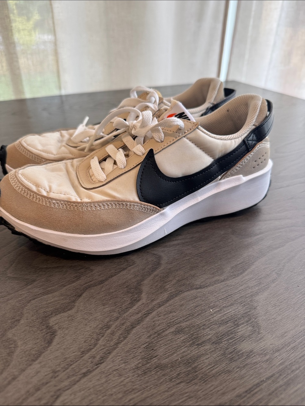 Nike woman’s Beige and Black Low-Top Sneakers